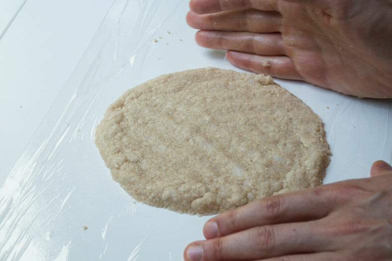 Shaping the dough of a vegan apple pie