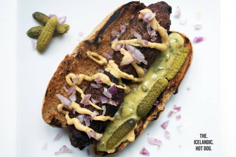 This is pylsur, the infamous Icelandic hot dog topped with homemade mustard, remoulade, raw onions and cornichon