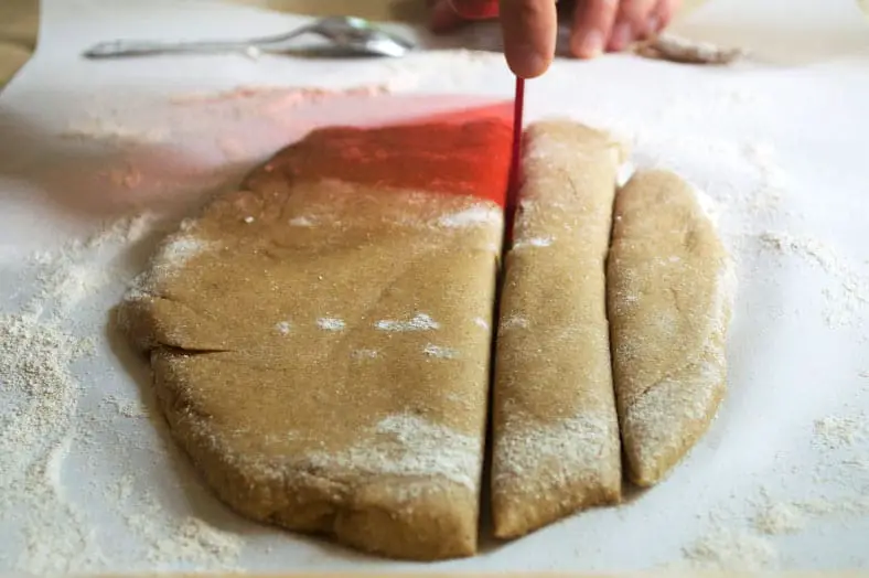 Cutting the dough for Mahamri, a yummy and beautiful Kenyan Cardamom Beignets or Doughnut