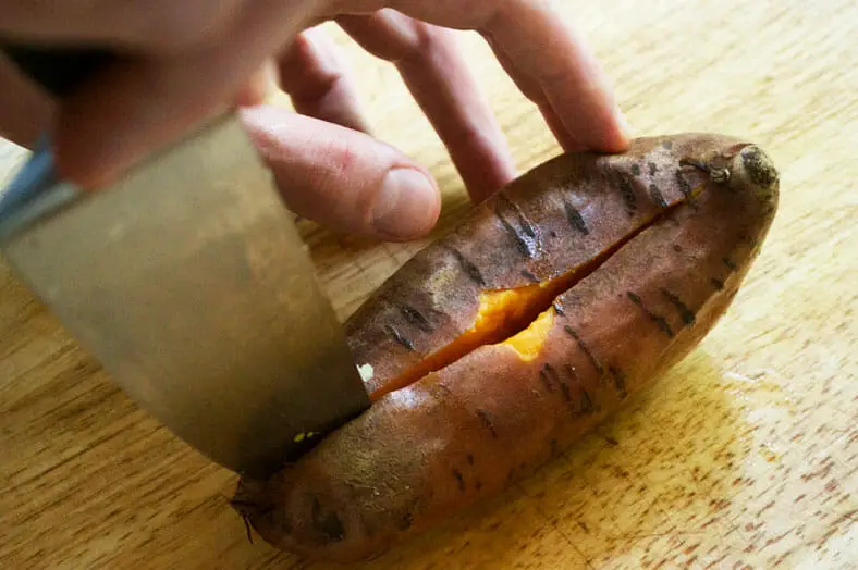 To make Kaukau, a Papua New Guinean Sweet Potato dish, you first have to bake the potato and then cut it open (once cooled) to scoop out the potato inside