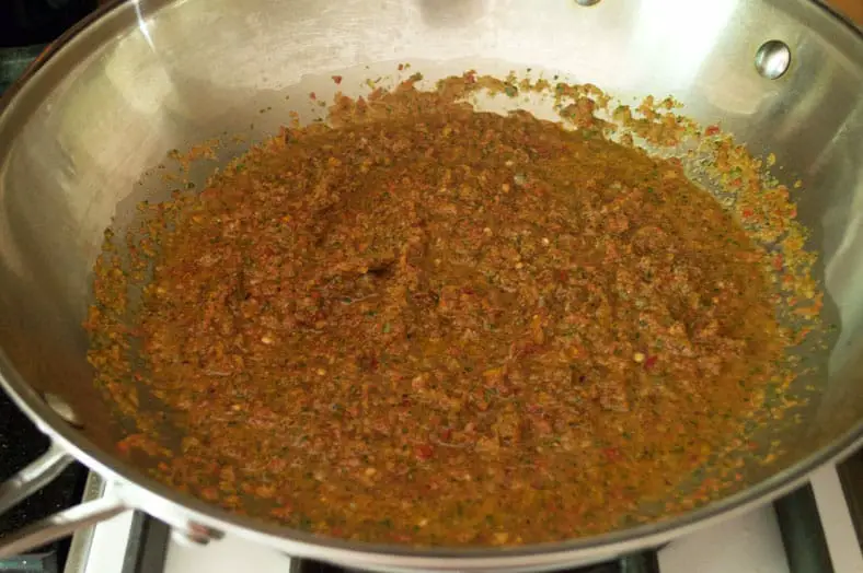 A key ingredient in Puerto Rican Mamposteao is sofrito! Sofrito is made up of onion, cilantro, bell peppers and various spices that are all blended together