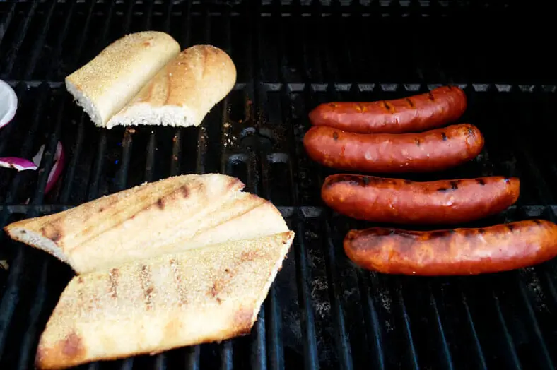 After you make chimichurri for the Argentine Choripan, heat up the grill and once hot throw on the chorizo and baguette for a few minutes, being mindful of rotating the sausages and bread to cook evenly