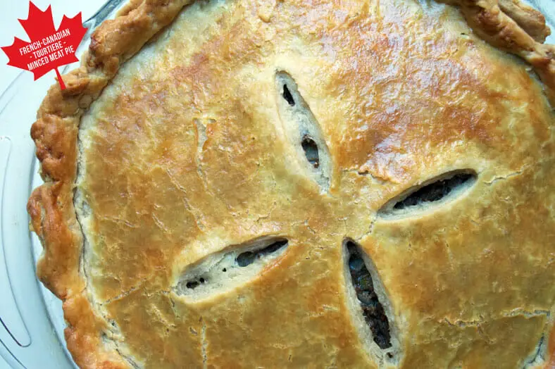 When you've made your filling, enclosed it in your pie crusts and baked it to perfection, this is what you can expect to see with your tourtière (French Canadian Quebecois Christmas meat pie). Take one bite and enjoy the nutmeg, cinnamon, allspice and clove flavors!