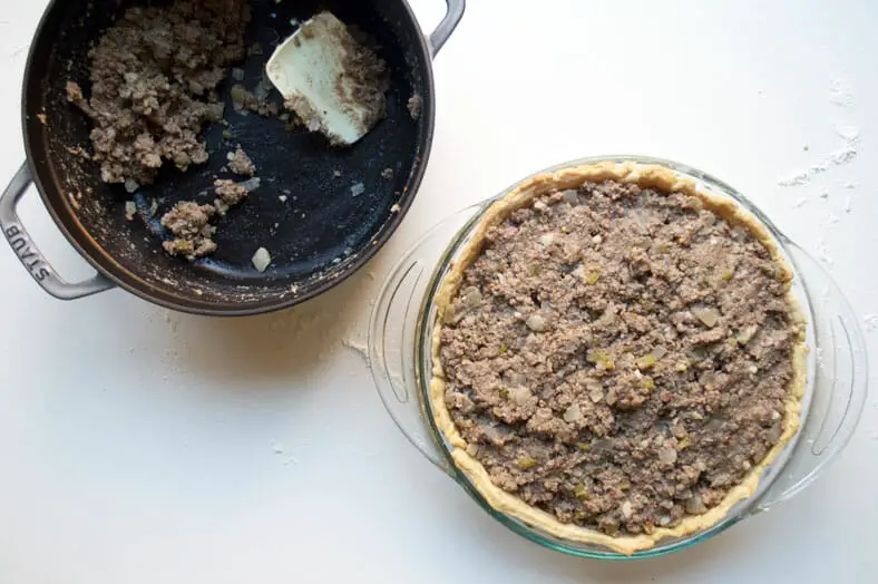When it comes to filling your pie crust with meat filling for tourtière (Canadian Christmas spiced meat pie), there's no such thing as too much