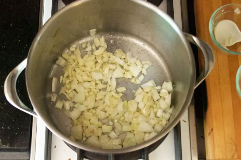 The popular Czech Garlic Soup, Cesnecka, packs a punch with about a whole head of garlic. Start by bashing the cloves and then adding them to a pot with some simmering butter, after a few minutes you'll then add your diced onion.