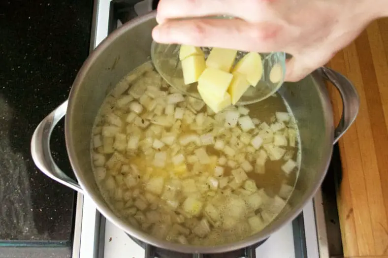 The popular Czech Garlic Soup, Cesnecka, calls for about a whole head of garlic, onion, spices, an amazing homemade broth and then a diced and peel potato to really round out the soup.